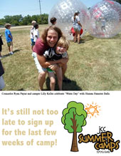 Counselor Ryan Payne and camper Lilly Keller on water day wih Human Hamster Balls